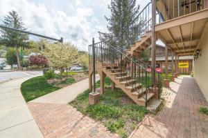 a staircase on the side of a building at All Aboard Stylish Downtown Loft, Walk to Restaurants, Shops, Train in Bryson City