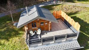 an overhead view of a small log cabin at The Forest House in La Comballaz