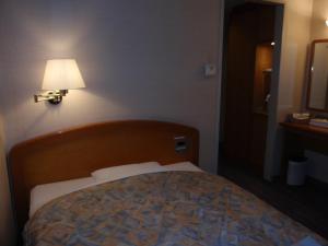 Postel nebo postele na pokoji v ubytování Hotel Crown Hills Okaya