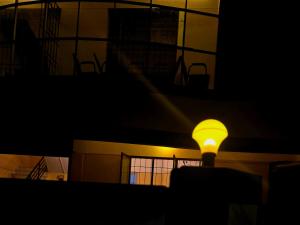 a light in the middle of a building at night at LUXUS INN JA Star in Chacka