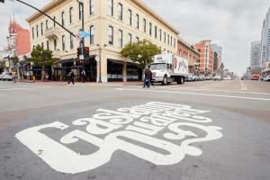 a bus stop sign on the street in a city at Kasa Gaslamp Quarter San Diego in San Diego
