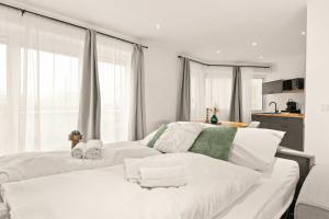 Postel nebo postele na pokoji v ubytování Superior Apartment Dingolfing - Design & Komfort + 14 fotografií