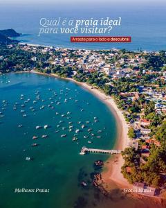 Vista aérea de una playa con barcos en el agua en HN-Hotel Natal Penha, en Penha