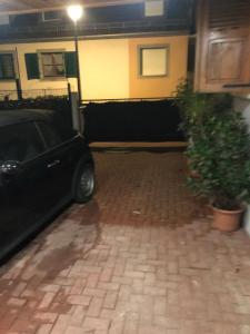 a car parked in a parking lot with a plant at Gîte au cœur du vignoble in Riquewihr