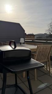 a toaster sitting on a bench on a roof at Deluxe Apartment Dingolfing - Design & Space in Dingolfing
