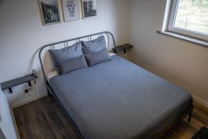 Ένα ή περισσότερα κρεβάτια σε δωμάτιο στο Landelijk gelegen bungalow De Kleine Wulfter