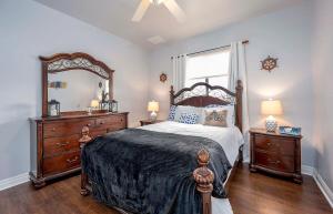 a bedroom with a large bed and a large mirror at Surfside in Cape Coral +27 photos