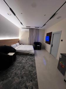 En eller flere senge i et værelse på Relax Home