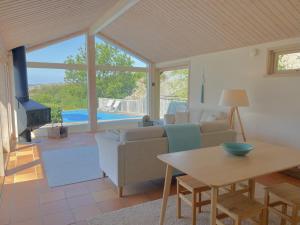 Гостиная зона в Architect-designed villa with pool, sauna and sea view in Mjörn SE09124