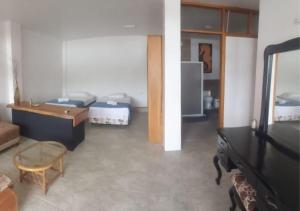 Ένα ή περισσότερα κρεβάτια σε δωμάτιο στο Akasha Galápagos +3 φωτογραφίες