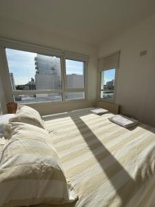 Ένα ή περισσότερα κρεβάτια σε δωμάτιο στο Alquiler temporal con cochera privada zona centro