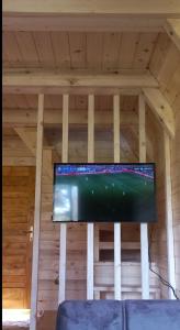 a flat screen tv hanging from a ceiling at Chalet Čilac in Žabljak