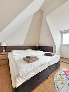 Postel nebo postele na pokoji v ubytování Hotel Mujen Lux Tutic - Free Spa & Wellness