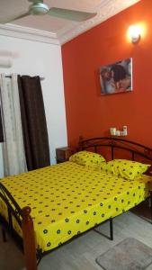 Ένα ή περισσότερα κρεβάτια σε δωμάτιο στο MAG GUEST house