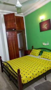 Ένα ή περισσότερα κρεβάτια σε δωμάτιο στο MAG GUEST house