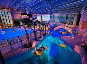 an indoor water park with people in tubes at Leśna Przystań Rumia - obok Gdyni i Aquaparku Reda in Rumia