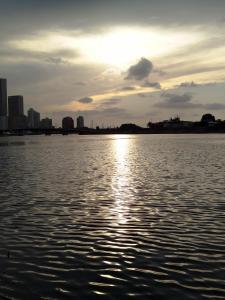 a view of a body of water with the sun setting at Ebratt Inn in Cartagena de Indias