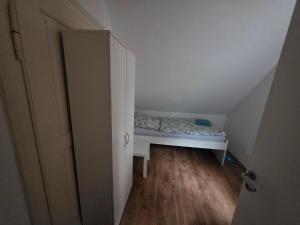 Ένα ή περισσότερα κρεβάτια σε δωμάτιο στο Nika