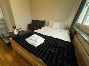 Ένα ή περισσότερα κρεβάτια σε δωμάτιο στο Cozy Private Room in Uppsala