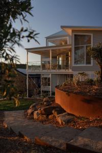 a large house with a porch at Oceano House in Copacabana