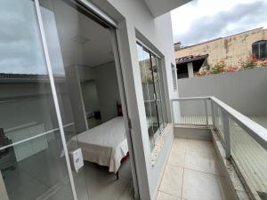a room with a bed on a balcony at Casa de David in Socorro