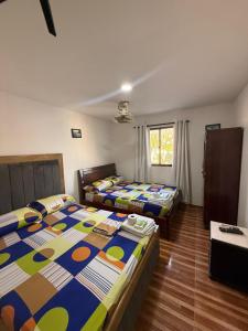 Postel nebo postele na pokoji v ubytování Aparta Hotel Palacios