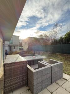 a patio with a table in a backyard at My Deer Apartment in Vienna