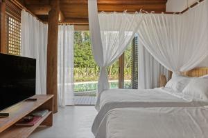 Ένα ή περισσότερα κρεβάτια σε δωμάτιο στο Casa Guariní - Algodões Beach, Peninsula de Maraú, Bahia