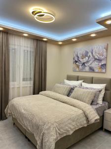Ένα ή περισσότερα κρεβάτια σε δωμάτιο στο Golden Time SM Apartman