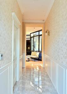 a hallway with a living room with a couch at Arts Hotel by Square in Tbilisi City +54 photos