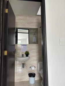 a bathroom with a sink and a toilet at apartamento milu in Salento