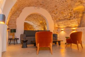 a living room with a couch and chairs at Exceptional Apartment Île Saint Louis - Jacuzzi in Paris