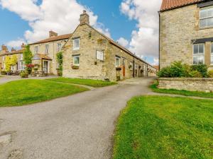 an old stone house with a driveway at 3 Bed in Newton-on-Rawcliffe 88958 in Newton