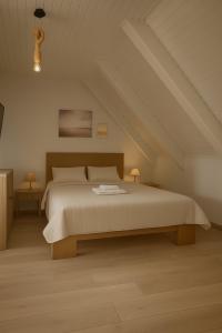 a bedroom with a large bed in a attic at Giorgos House Attic in Gialova