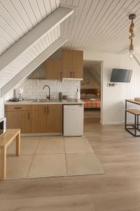 a kitchen with a sink and a counter top at Giorgos House Attic in Gialova