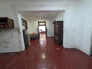an empty hallway in an old house with a red floor at Marvella dickwella in Dickwella