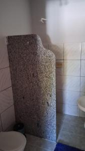 a bathroom with a shower with a toilet and a sink at Casa Alegria - Praia de Catuama -PE in Goiana +46 photos