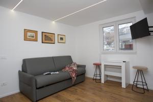 a living room with a couch and a table at Ski Gate - Main Street by Cervino View Experience in Breuil-Cervinia