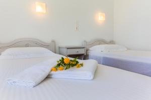 Postel nebo postele na pokoji v ubytování Roses Beach