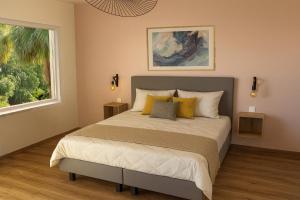 Ένα ή περισσότερα κρεβάτια σε δωμάτιο στο Pearl of Paradise