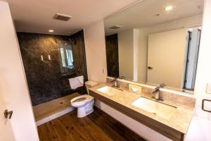 a bathroom with two sinks and a toilet at The Sierra House in Mammoth Lakes +28 photos