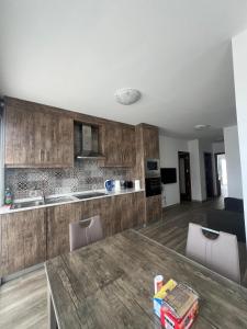 a kitchen with a table and chairs and a room at Bright and Convenient Penthouse in Central Malta in Msida