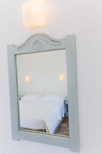 Postel nebo postele na pokoji v ubytování Roses Beach