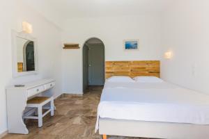 Postel nebo postele na pokoji v ubytování Roses Beach