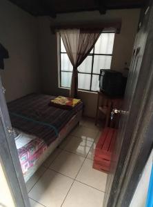 Postel nebo postele na pokoji v ubytování Hostal El calvario