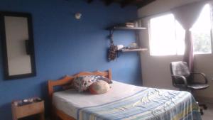 Ένα ή περισσότερα κρεβάτια σε δωμάτιο στο apartamento amplio