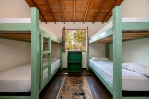 Postel nebo postele na pokoji v ubytování The Secret Buddha