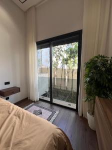 En eller flere senge i et værelse på A Suites