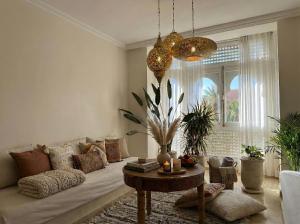 a living room with a couch and a table at Chimera Apartments & Suites in Marrakech