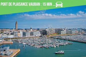 a group of boats docked in a harbor at Le Vert Calme in Le Havre